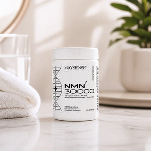 White supplement container labeled 'NMN 30000' by 'Maysense' on a light surface with a blurred background.