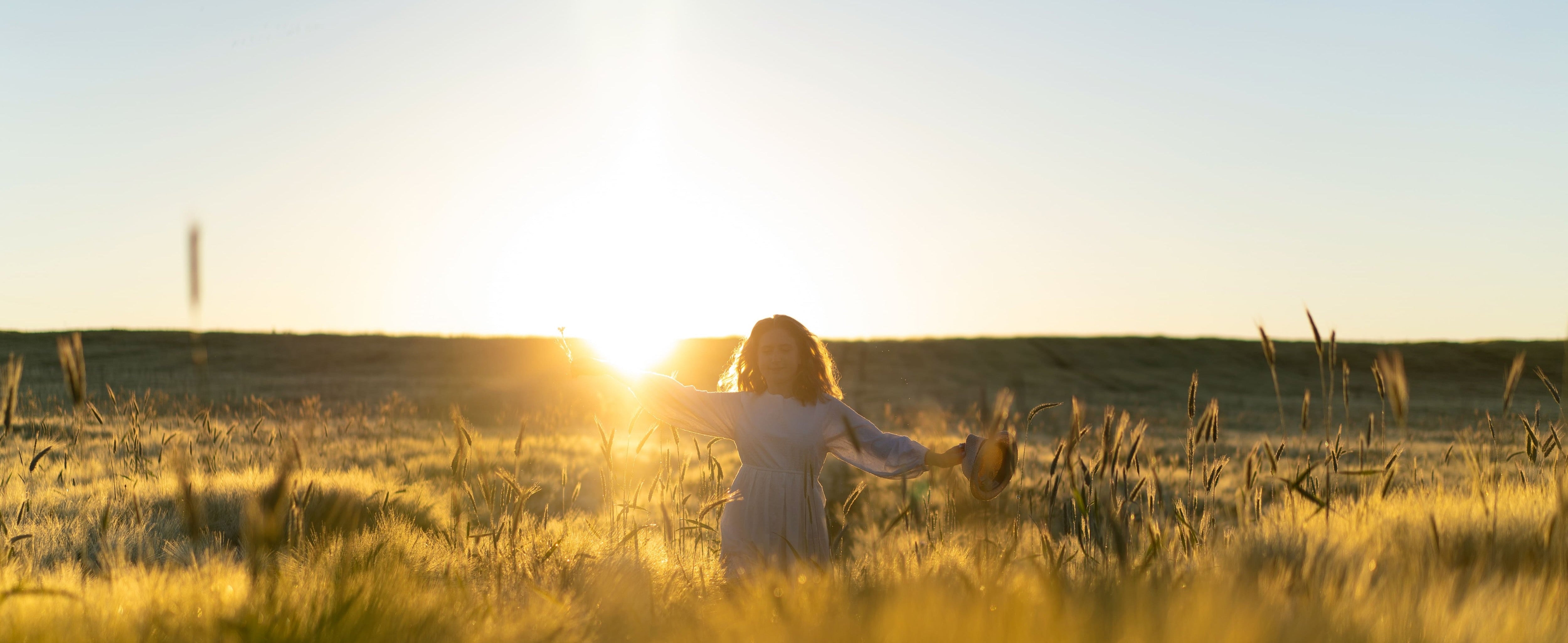 Young beautiful woman with long blond hair white dress wheat field early morning sunrise summer is time dreamers flying hair woman running across field rays 28f163c3 c075 4ee7 b621 ad823e9686c9