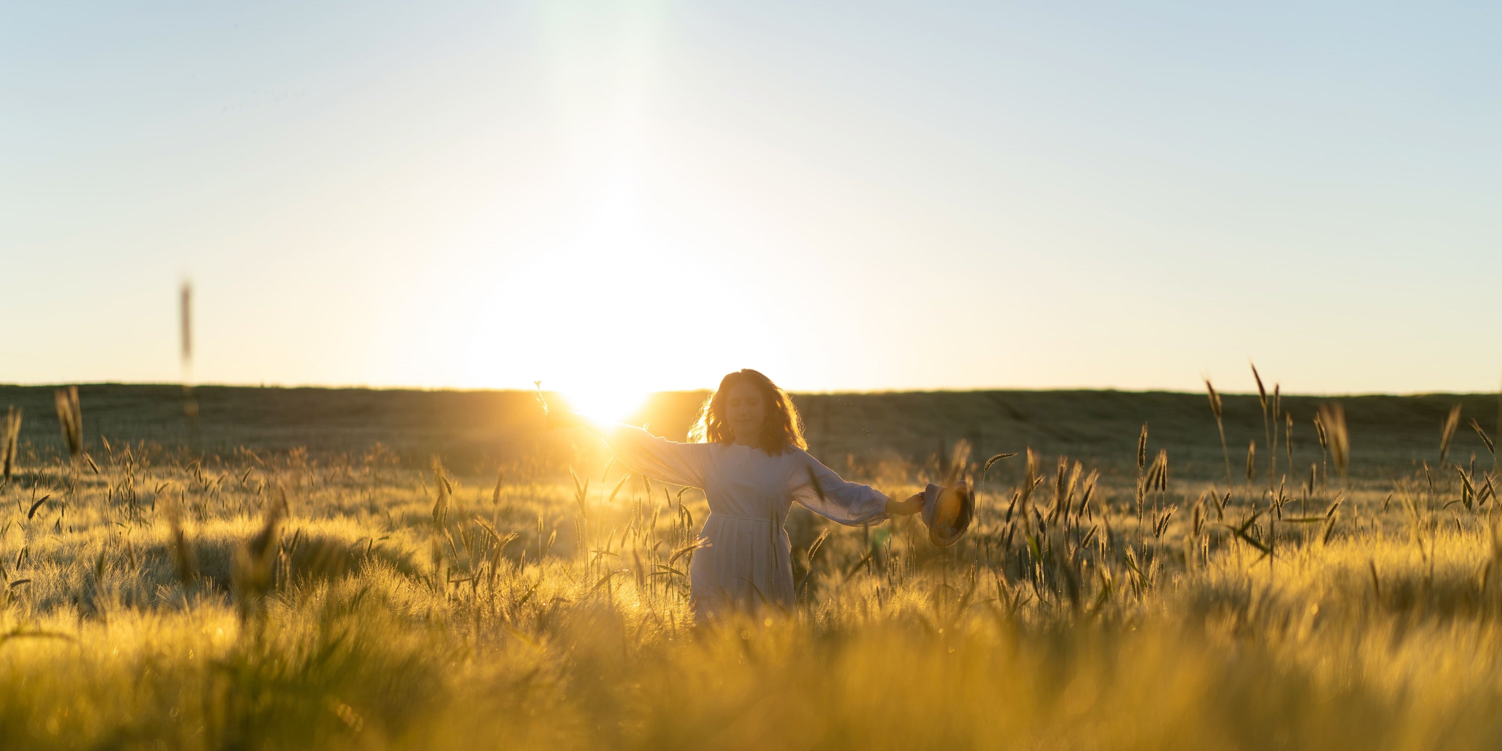 Young beautiful woman with long blond hair white dress wheat field early morning sunrise summer is time dreamers flying hair woman running across field rays 28f163c3 c075 4ee7 b621 ad823e9686c9