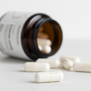 Close-up of MitoVantage 60 vegetarian capsules showing high-purity powder and pharmaceutical-grade texture
