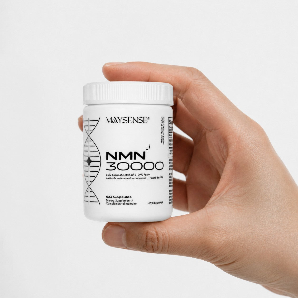 Hand holding a Maysense NMN 30000 supplement container against a white background