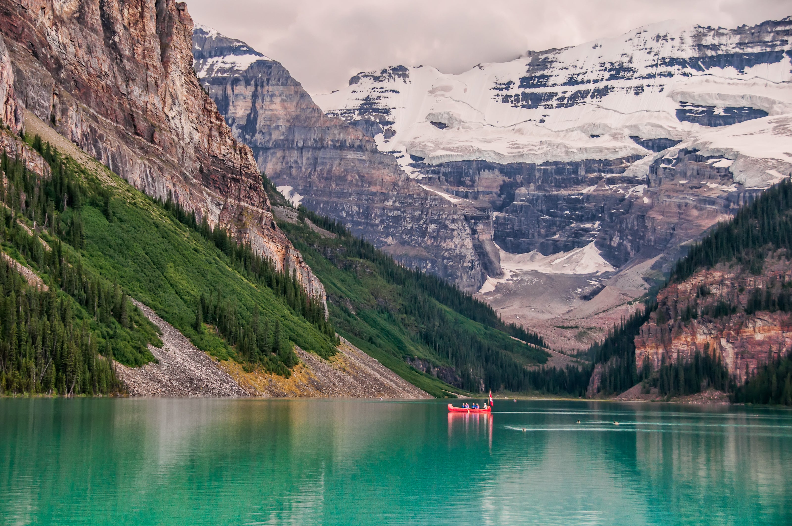 Red boat lake near mountain