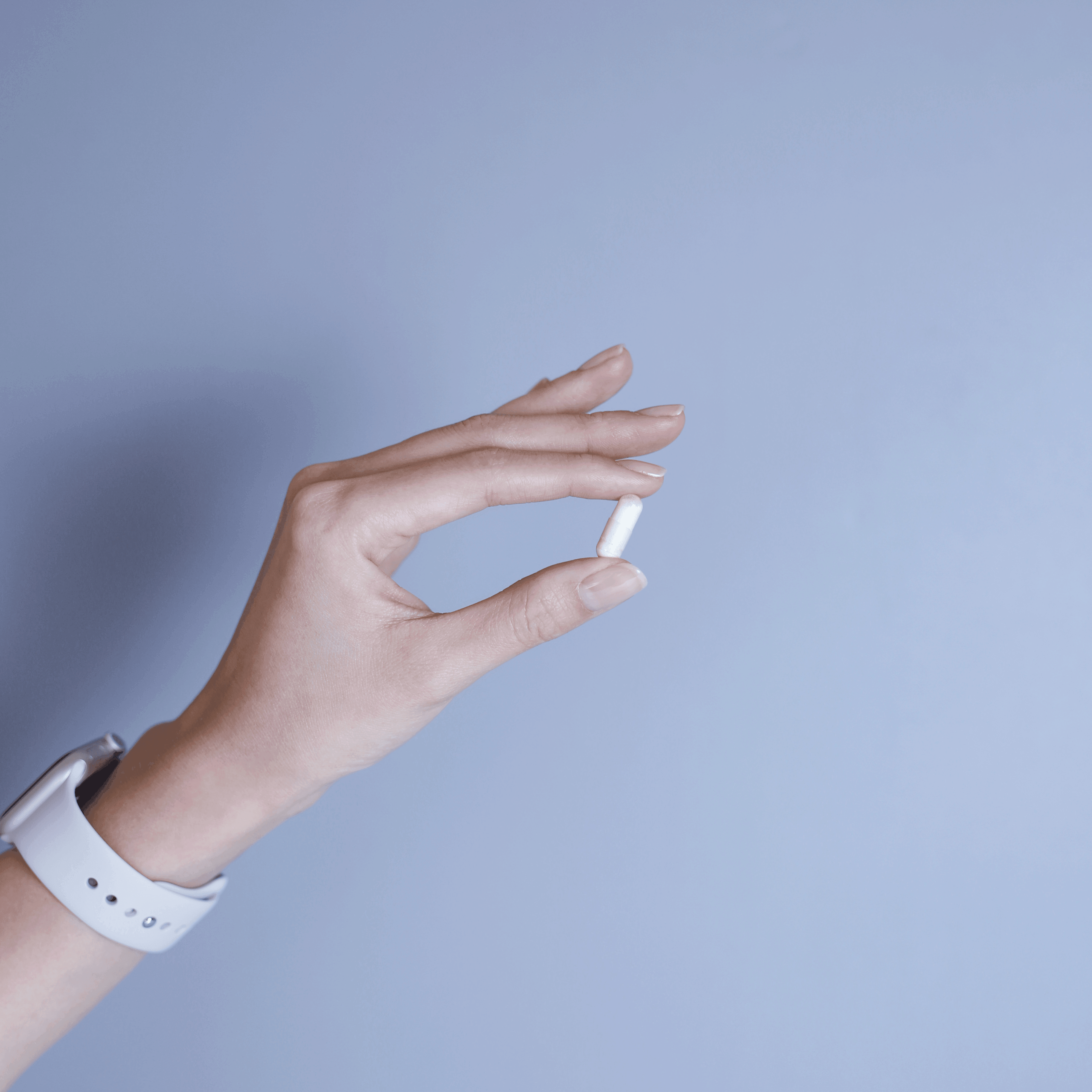 Close-up of MAYSENSE NMN 10800 white capsules
